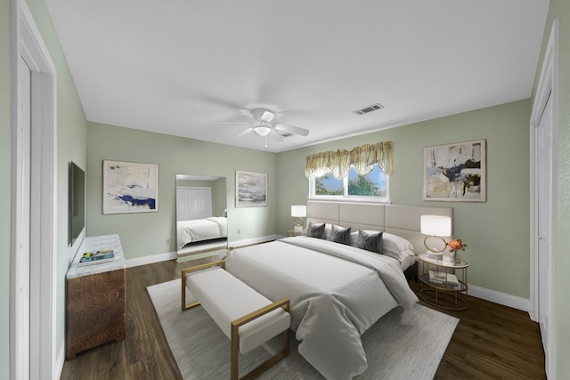 bedroom with ceiling fan and dark hardwood / wood-style flooring