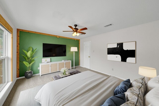 carpeted bedroom featuring ceiling fan