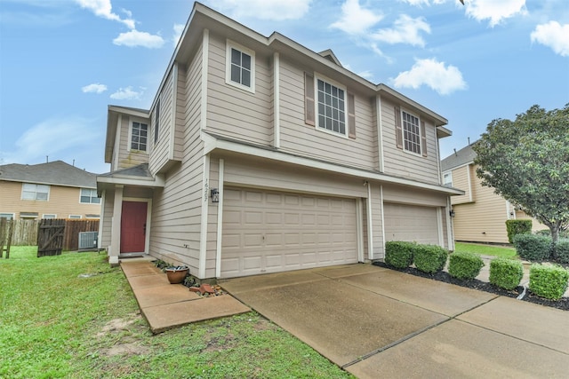 view of front of home with a garage and a front lawn