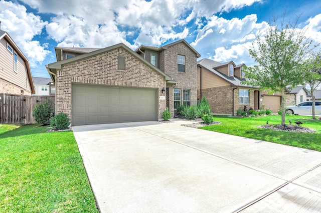 view of front of home featuring a garage and a front lawn