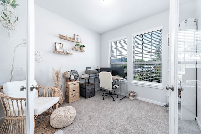 home office featuring light carpet and french doors