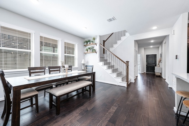 dining area featuring dark hardwood / wood-style flooring