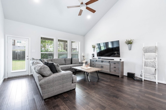 living room featuring plenty of natural light, ceiling fan, high vaulted ceiling, and dark wood-type flooring