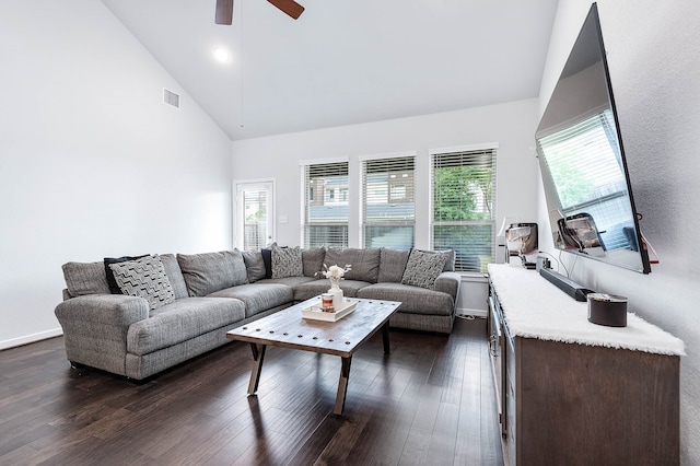 living room featuring dark wood-type flooring, ceiling fan, and high vaulted ceiling