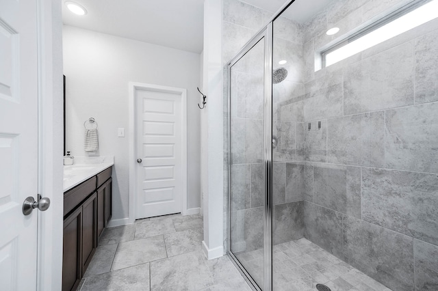 bathroom with vanity and walk in shower