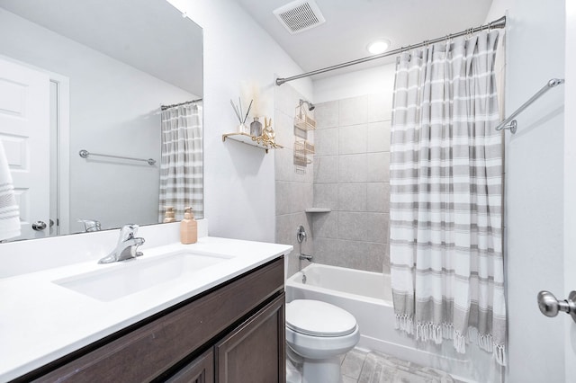 full bathroom featuring vanity, toilet, tile patterned floors, and shower / bath combo with shower curtain