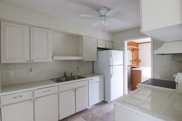 kitchen with white cabinetry, white appliances, tile countertops, and ceiling fan