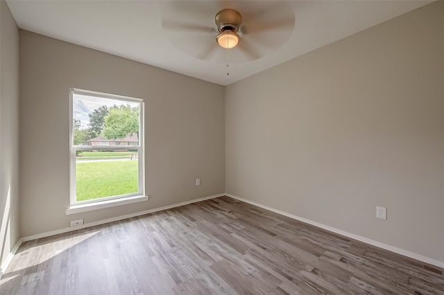 empty room with light hardwood / wood-style flooring and ceiling fan