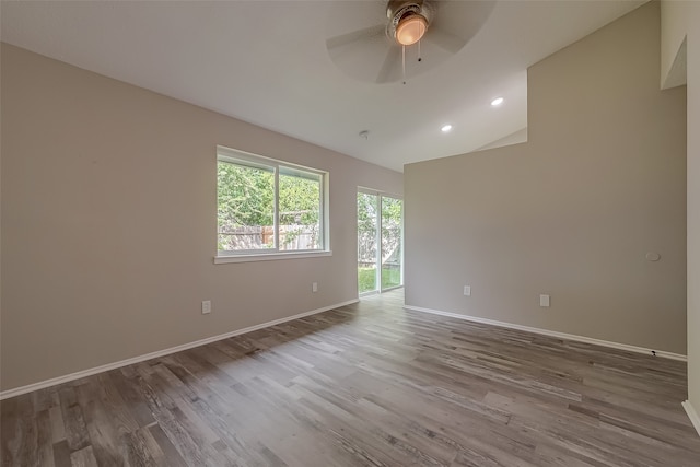 unfurnished room with ceiling fan and wood-type flooring