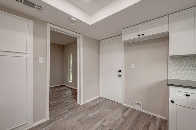 washroom with light hardwood / wood-style floors