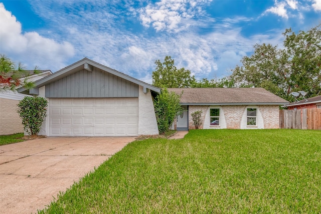 ranch-style home featuring a garage and a front yard