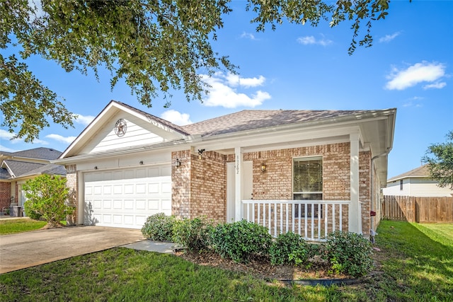 ranch-style home featuring a front yard and a garage