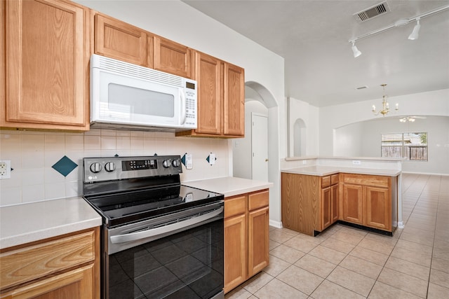 kitchen featuring an inviting chandelier, decorative light fixtures, stainless steel electric stove, decorative backsplash, and light tile patterned flooring