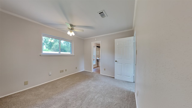 unfurnished room with ceiling fan, light colored carpet, and ornamental molding