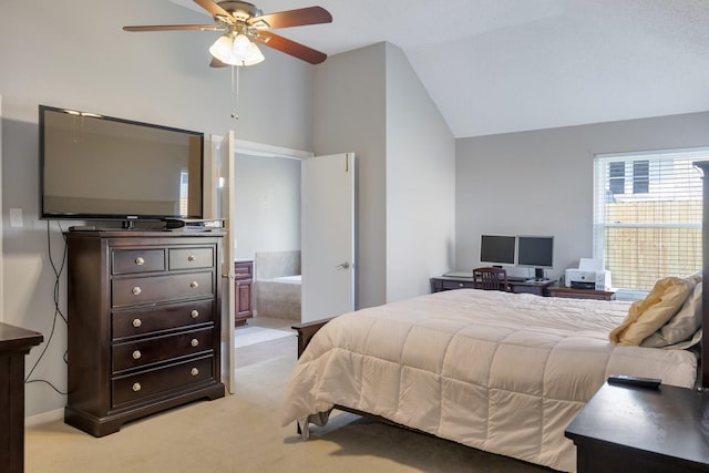 bedroom featuring ceiling fan, ensuite bathroom, vaulted ceiling, and light carpet