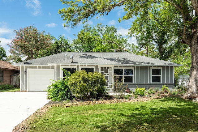 single story home with a front lawn and a garage