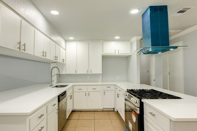 kitchen with white cabinetry, light tile patterned floors, stainless steel appliances, sink, and island exhaust hood