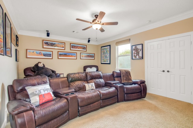 cinema featuring ceiling fan, carpet, and ornamental molding