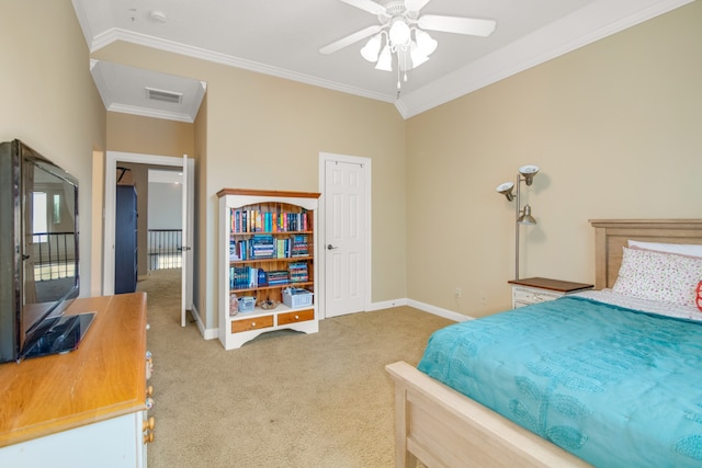 carpeted bedroom with ceiling fan and crown molding