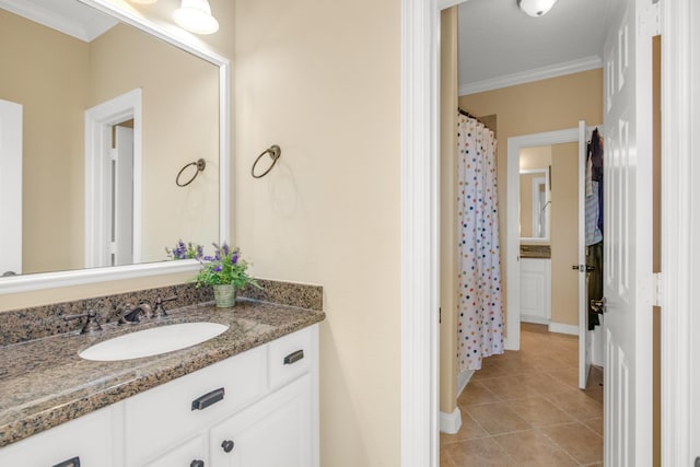 bathroom with a shower with shower curtain, tile patterned flooring, crown molding, and vanity