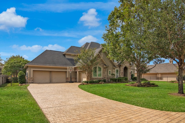 view of front facade featuring a front lawn and a garage