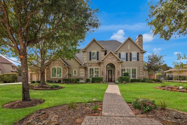 view of front of property with a front lawn