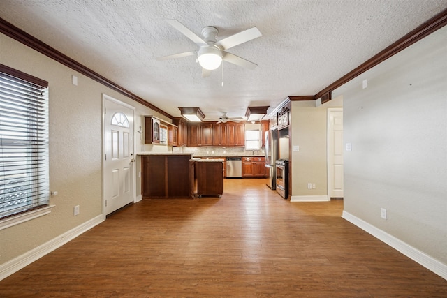 kitchen featuring dishwasher, a textured ceiling, light hardwood / wood-style flooring, and ceiling fan