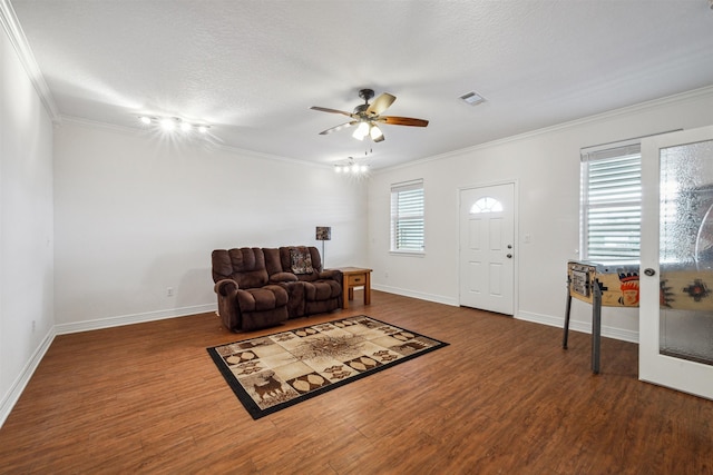 entrance foyer with a textured ceiling, crown molding, ceiling fan, and hardwood / wood-style flooring