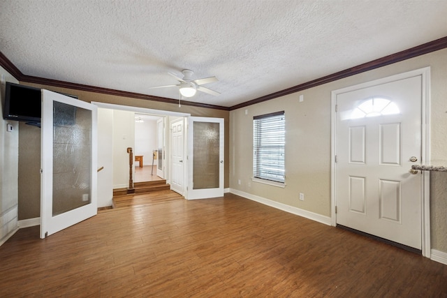 foyer featuring ornamental molding, a textured ceiling, wood-type flooring, and ceiling fan