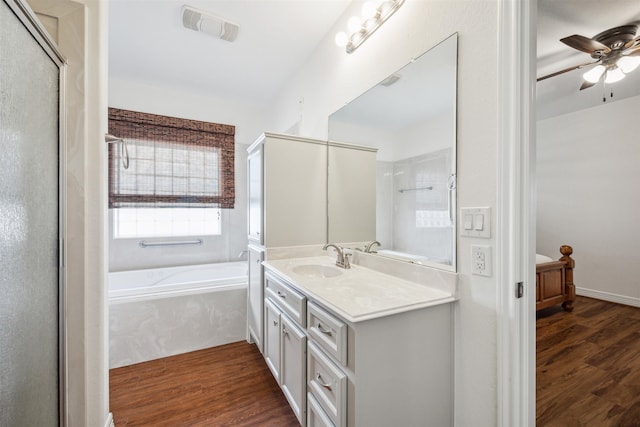 bathroom featuring vanity, wood-type flooring, separate shower and tub, and ceiling fan