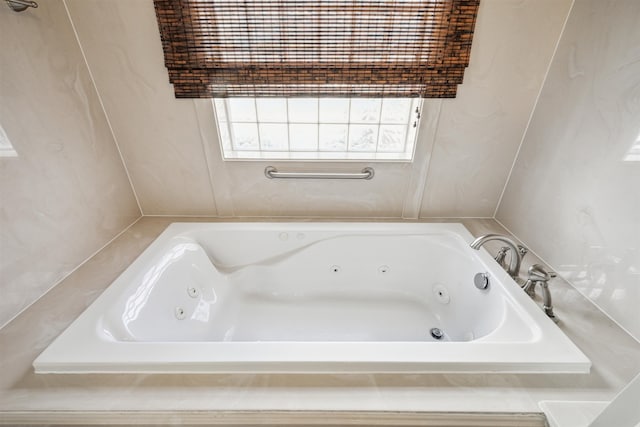 bathroom featuring tiled bath