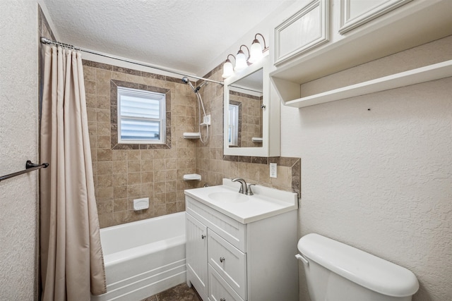 full bathroom featuring a textured ceiling, vanity, toilet, and shower / bathtub combination with curtain