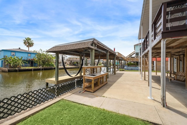 surrounding community featuring a boat dock and a water view