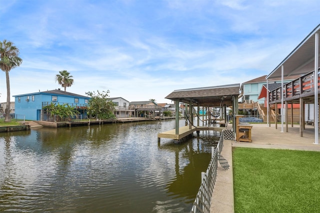 dock area featuring a yard and a water view