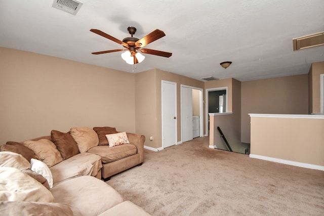 living room with light carpet and ceiling fan