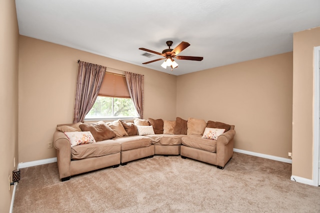 carpeted living room featuring ceiling fan