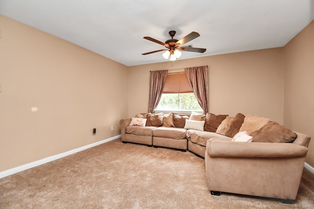 carpeted living room with ceiling fan