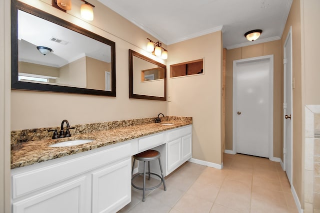 bathroom with tile patterned flooring, vanity, and crown molding