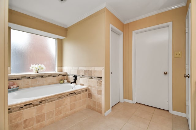 bathroom featuring ornamental molding, tile patterned flooring, and tiled bath