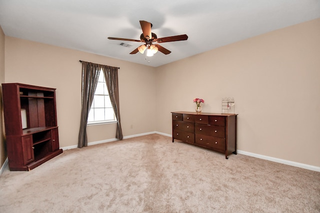 unfurnished bedroom featuring ceiling fan and light carpet