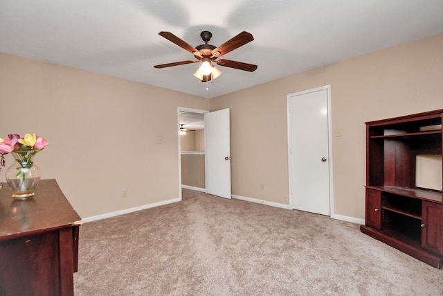 unfurnished bedroom with ceiling fan and light colored carpet