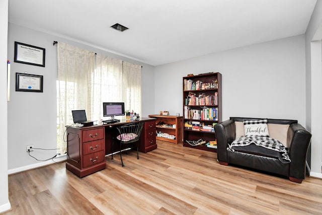 office space featuring light wood-type flooring