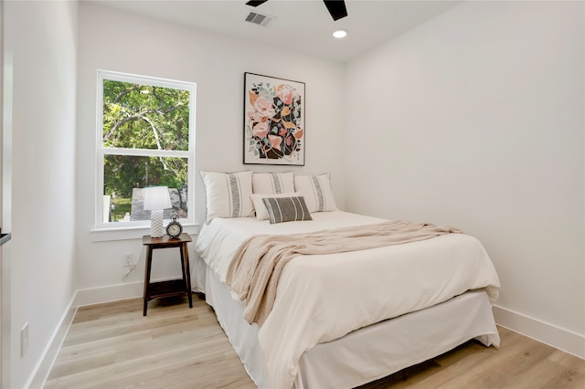 bedroom featuring light hardwood / wood-style floors and ceiling fan