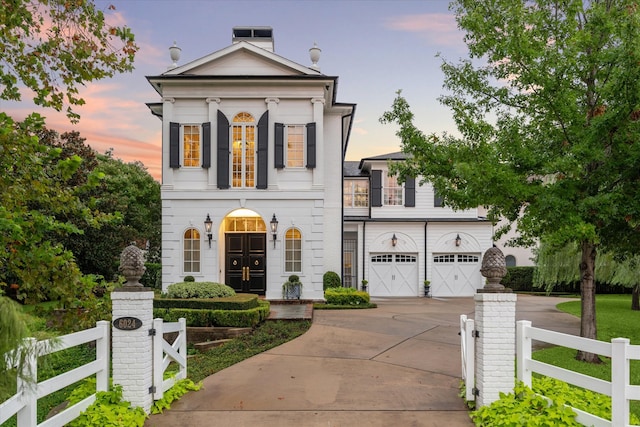 greek revival house with a garage