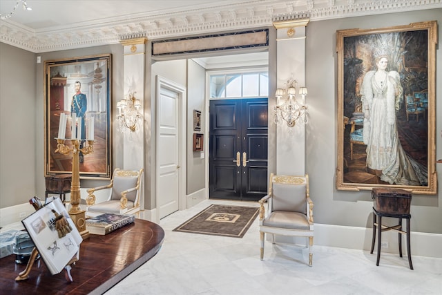 foyer featuring ornamental molding