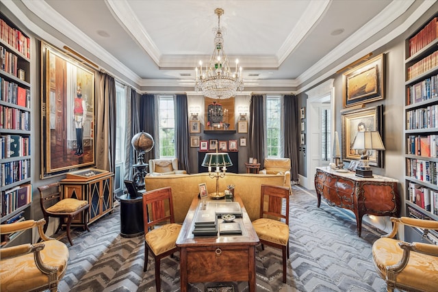 office featuring an inviting chandelier, a raised ceiling, and ornamental molding