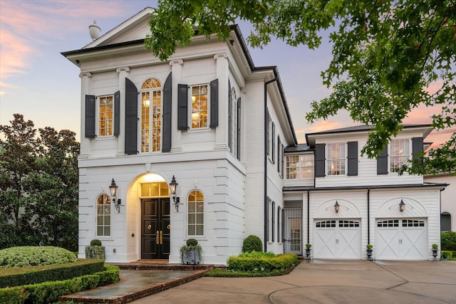 neoclassical home with a garage