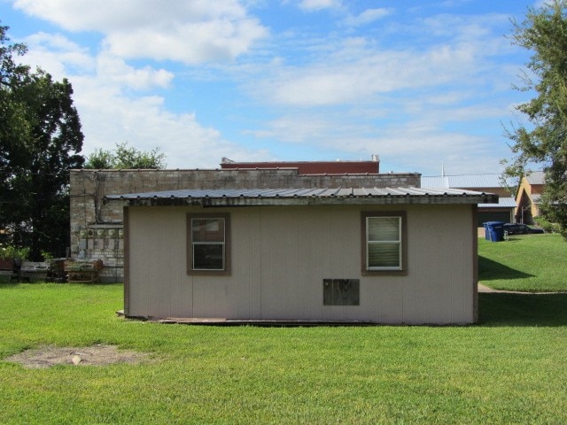 view of home's exterior with a yard