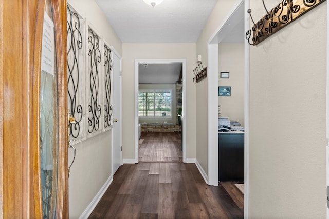 hall with dark hardwood / wood-style floors