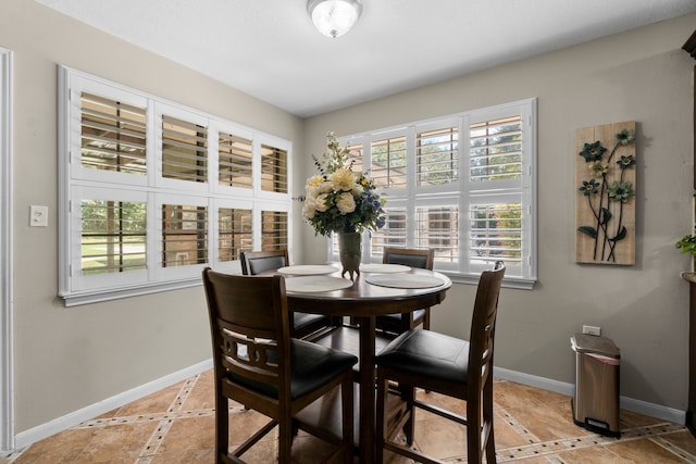 dining room featuring light tile patterned flooring